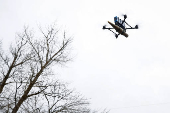 Ukrainian serviceman practice with an FPV drone, in Kharkiv region