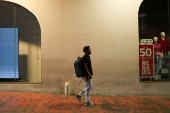 Ecuadorian immigrant Kenyi Arturo Melendez Sanchez, which had his asylum appointment canceled through the CBP One app and applied for asylum in Mexico, works in a barber shop in Tapachula