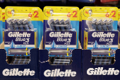 Gillete products are displayed on a shelf in a supermarket