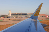 The control tower and the terminals of Malaga-Costa del Sol airport are pictured from a passenger aircraft of Vueling airlines, in Malaga