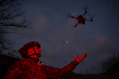 Policeman of the 'Khyzhak' Brigade launches a drone at a position in a front line near the town of Toretsk