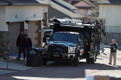 Investigators search a townhouse, in relation to the explosion in Las Vegas of a Tesla Cybertruck