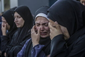 Palestinians mourn their dead at Deir Al Balah hospital after Israeli airstrike in central Gaza