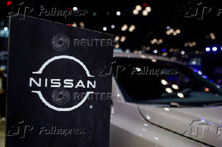 FILE PHOTO: A Nissan logo is seen next to a vehicle during the New York International Auto Show