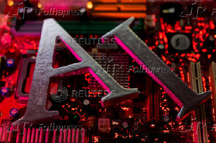 FILE PHOTO: Illustration shows AI (Artificial Intelligence) initials and computer motherboard