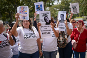 Relatives of detained Venezuelans protest, outside the public prosecutor's headquarters, in Caracas