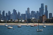 People relax on Melbourne St Kilda beach