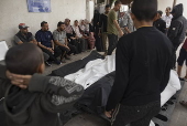 Palestinians mourn their dead following airstrike on Rafah, southern Gaza