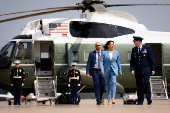 U.S. Democratic presidential nominee Kamala Harris walks to board Air Force Two at Joint Base Andrews in Maryland