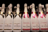 Moet Champagne is displayed on a shelf in a supermarket