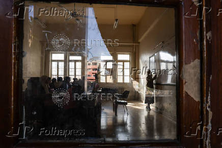 Students in a classroom after authorities announced the reopening of schools, in Damascus