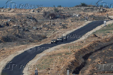 Israeli military vehicles manoeuvre inside the Gaza Strip, in southern Israel