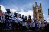Campaigners for and against assisted dying gather during a debate in Parliament
