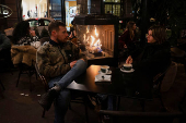 Tourists enjoy last days of gas heaters on Barcelona's terraces