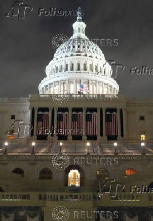 General view shows the West front of the U.S. Capitol building during snowfall in Washington