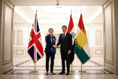 Britain's Home Secretary Yvette Cooper shakes hands with President of Kurdistan Region Nechirvan Barzani during a visit at the Kurdish Region Presidency, in Erbil