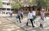 Election staff carry Voter Verifiable Paper Audit Trails (VVPAT) and Electronic Voting Machines (EVM) to a polling station, ahead of the first phase of the election, in Bikaner