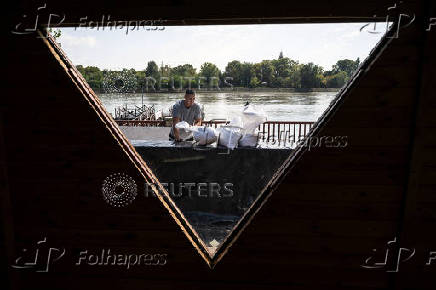 People take preventive measures for the flooding of the Danube, in Budapest