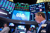 Traders work on the floor of the NYSE in New York