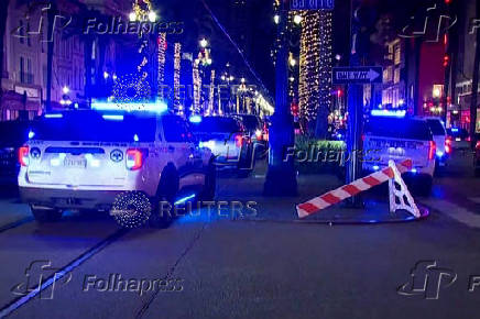 Police attend the scene where a pickup truck drove into a large crowd on Bourbon Street in New Orleans