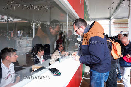 Tourists at the information center to register and receive a QR code to prove their payment of a fee for day trippers introduced by Venice