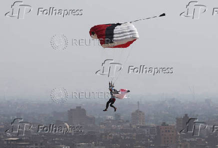 A professional skydiver flies on the outskirts of Egypt's capital Cairo during Egypt International Skydiving Festival 