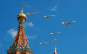 FILE PHOTO: Russian army Tupolev Tu-160 and Tupolev Tu-22M3 fly in formation over St. Basil's Cathedral during the rehearsal for the Victory Day parade in Moscow