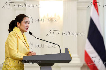 Thailand's Prime Minister Paetongtarn Shinawatra and her cabinet members attend a press conference in Bangkok