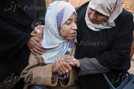 Palestinians mourn loved ones killed in Israeli strikes, in Khan Younis in the southern Gaza Strip