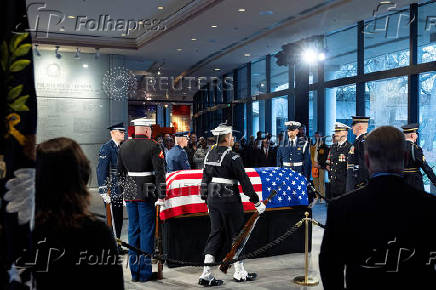 Mourners view the casket of former U.S. President Jimmy Carter as he lies in repose at the Jimmy Carter Presidential Library and Museum