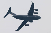 U.S. military plane that air-dropped humanitarian aid in the Gaza Strip flies over Israel