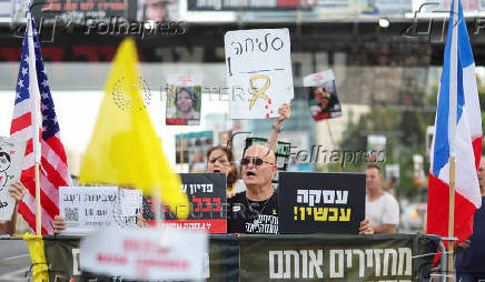 People take part in a protest demanding the immediate release of hostages, Tel Aviv