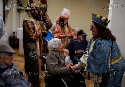 The Three Wise Men visit children and elderly people, ahead of the Epiphany parade, in Ronda