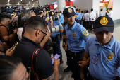 Police and media standby for the arrival of former Philippine president Rodrigo Duterte from Hong Kong