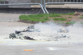 Aftermath of a person covered in flames outside NY courthouse of former U.S. President Trump's criminal hush money trial