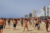 People spend time at the beach, in Tel Aviv