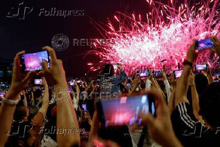 FILE PHOTO: Fireworks light up over Victoria Harbour for the Chinese Labour Day 'Golden Week' holiday, in Hong Kong