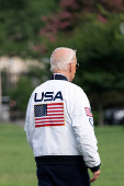 U.S. President Joe Biden wears the team USA Olympics jacket as he departs from the South Lawn of the White House