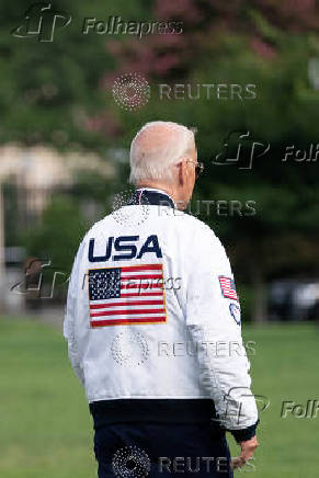 U.S. President Joe Biden wears the team USA Olympics jacket as he departs from the South Lawn of the White House