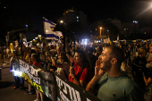 People attend a protest against the government and to show support for the hostages who were kidnapped during the deadly October 7 attack, in Tel Aviv