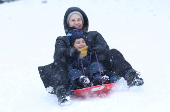 People are sledging in Aviemore, Scotland,