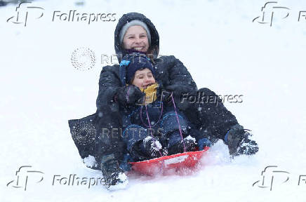 People are sledging in Aviemore, Scotland,