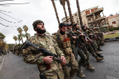 Khaled Brigade, a part of Hay'at Tahrir al-Sham (HTS), hold a military parade, in Damascus