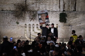 Hostages' families participate in lighting of first Hanukkah candle at Western Wall in Jerusalem