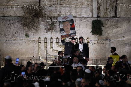 Hostages' families participate in lighting of first Hanukkah candle at Western Wall in Jerusalem