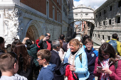Tourists walk in St Mark's Square on the day Venice municipality introduces a new fee for day trippers