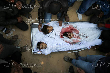 Palestinians mourn loved ones killed in Israeli strikes, in Khan Younis in the southern Gaza Strip