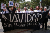 Relatives of detained Venezuelans protest, outside the public prosecutor's headquarters, in Caracas