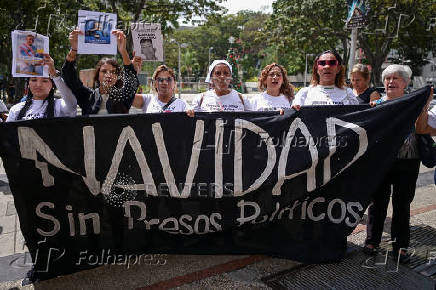 Relatives of detained Venezuelans protest, outside the public prosecutor's headquarters, in Caracas