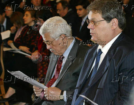 FILE PHOTO: Palestinian leader Mahmoud Abbas and interim president Rawhi Fattouh attend Christmas Mass in ...